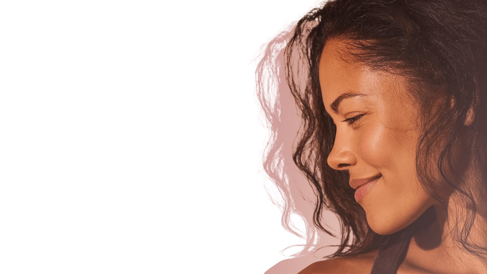 Woman with warm golden light — GloWellness